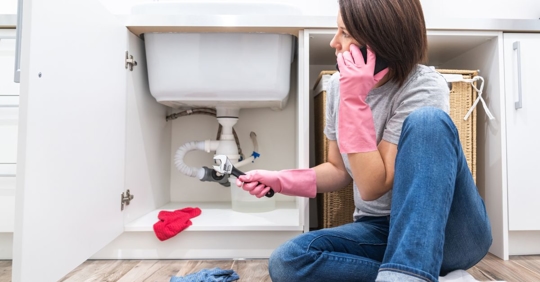 woman calling plumber