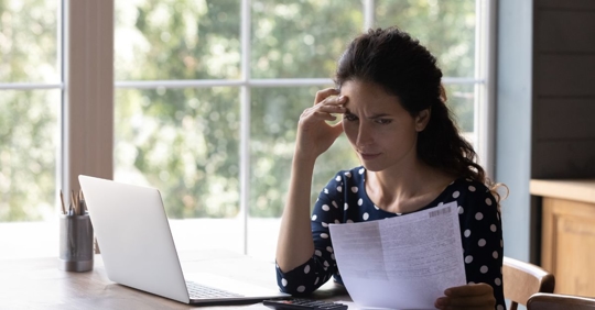 woman looking at high water bill